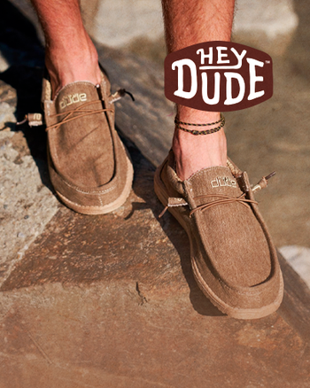 Hey dude brand fashion casual shoes in brown color on a stone modeling